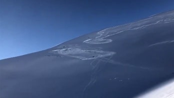 Avalanche in Colorado partially buries snowmobiler in 'terrifying' video