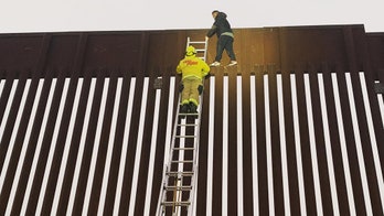 California firefighters rescue man stuck on top of US-Mexico border wall