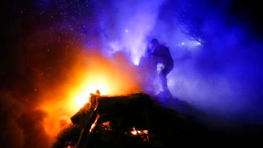 Ukrainians throw bricks at buses carrying coronavirus evacuees from China