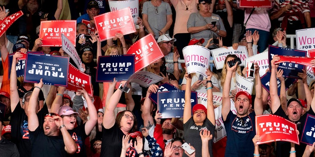 Supporters cheer as US President Donald Trump arrives to deliver remarks at a Keep America Great rally in Phoenix, Arizona, on February 19, 2020. (Photo by JIM WATSON/AFP via Getty Images)