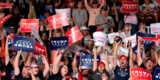 Supporters cheer as US President Donald Trump arrives to deliver remarks at a Keep America Great rally in Phoenix, Arizona, on February 19, 2020. (Photo by JIM WATSON/AFP via Getty Images)