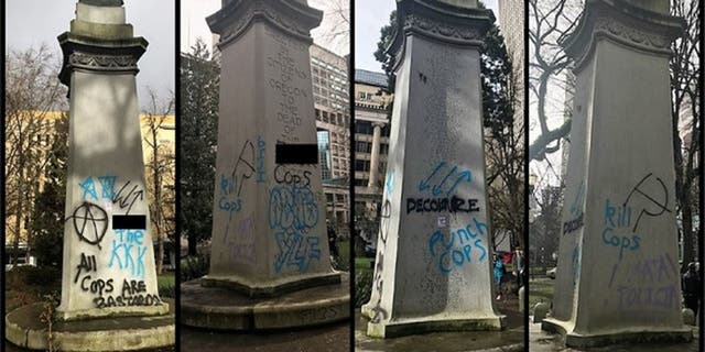 Messages can be seen spray-painted on a war memorial in Portland, Ore. after a demonstration on Saturday. (Portland Police Bureau)