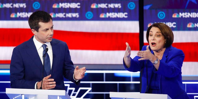 Democratic presidential candidates, Sen. Amy Klobuchar, D-Minn., right, speaks as former South Bend Mayor Pete Buttigieg looks on during a Democratic presidential primary debate Wednesday, Feb. 19, 2020, in Las Vegas, hosted by NBC News and MSNBC. (AP Photo/John Locher)