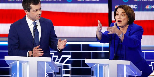 Democratic presidential candidates, Sen. Amy Klobuchar, D-Minn., right, speaks as former South Bend Mayor Pete Buttigieg looks on during a Democratic presidential primary debate Wednesday, Feb. 19, 2020, in Las Vegas, hosted by NBC News and MSNBC. (AP Photo/John Locher)