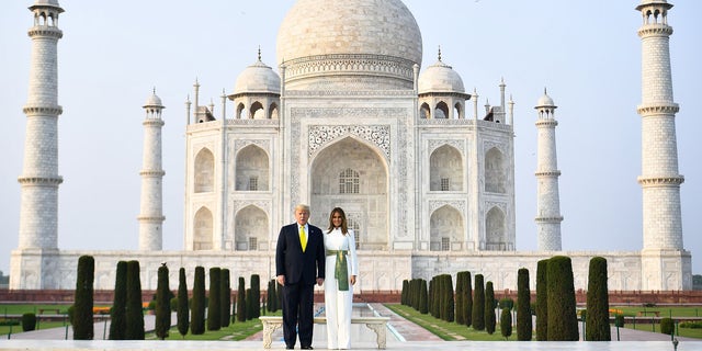 US President Donald Trump and First Lady Melania Trump pose as they visit the Taj Mahal in Agra on February 24, 2020. (Photo by Mandel NGAN / AFP) (Photo by MANDEL NGAN/AFP via Getty Images)