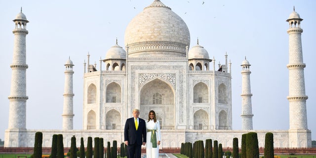 US President Donald Trump and First Lady Melania Trump pose as they visit the Taj Mahal in Agra on February 24, 2020. (Photo by Mandel NGAN / AFP) (Photo by MANDEL NGAN/AFP via Getty Images)