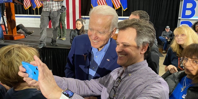 Former Vice President Joe Biden takes selfies with supporters at a post-Nevada caucus celebration, in North Las Vegas, Nevada on Feb. 22. 2020
