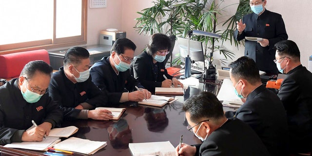In this undated photo distributed by the North Korean government, North Korean Premier Kim Jae Ryon, right top, has a meeting at the emergency anti-epidemic headquarter in Pyongyang, North Korea. The content of this image is as provided and cannot be independently verified.