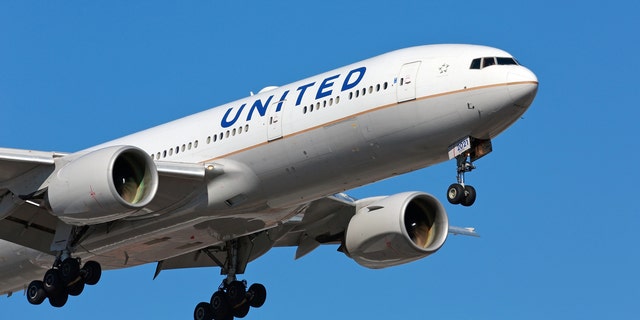CHICAGO, ILLINOIS / USA - March 10, 2018: A United Airlines passenger aircraft - Boeing 777 - arriving at Chicago O'Hare International Airport on a sunny morning.