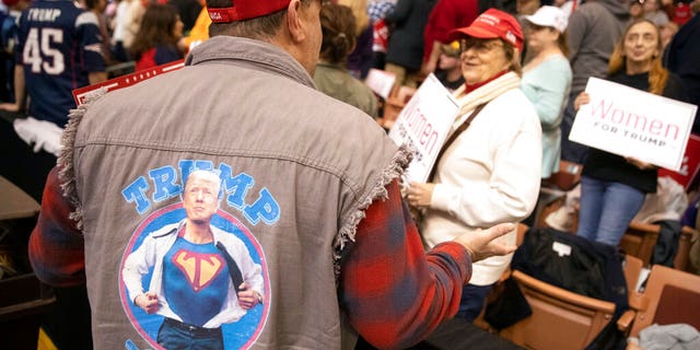 Supporters waiting for the start of President Trump's rally Monday in Manchester, N.H. (AP Photo/Mary Altaffer)