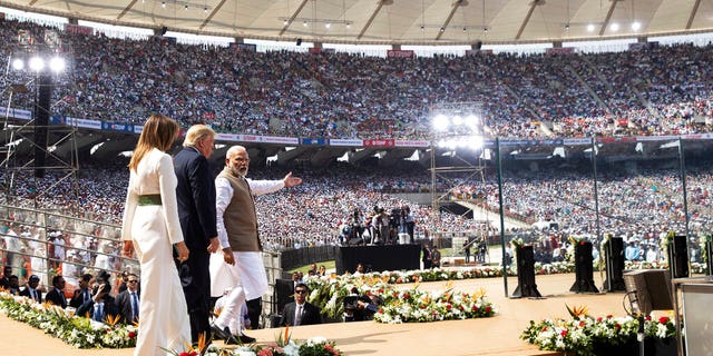 U.S. President Donald Trump, first lady Melania Trump, and Indian Prime Minister Narendra Modi arrive for a "Namaste Trump," event at Sardar Patel Stadium. (AP Photo/Alex Brandon)