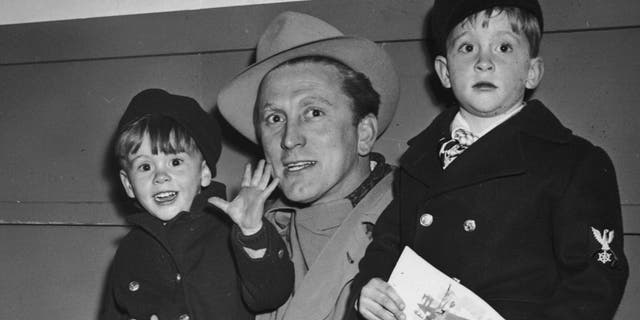 Kirk Douglas with sons Joel (left) and Michael (right). (Photo by Hulton Archive/Getty Images)