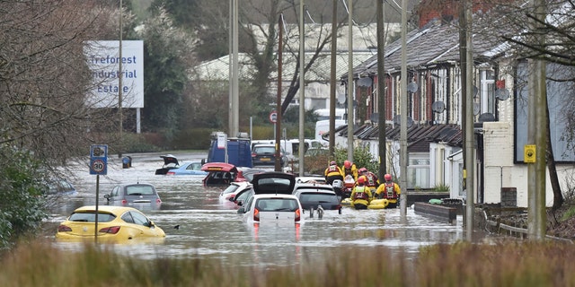 torm Dennis roared across Britain on Sunday, lashing towns and cities with high winds and dumping so much rain that authorities urged residents to protect themselves from flooding.