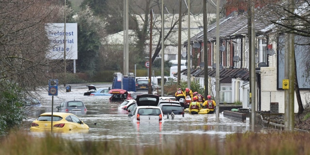 torm Dennis roared across Britain on Sunday, lashing towns and cities with high winds and dumping so much rain that authorities urged residents to protect themselves from flooding.