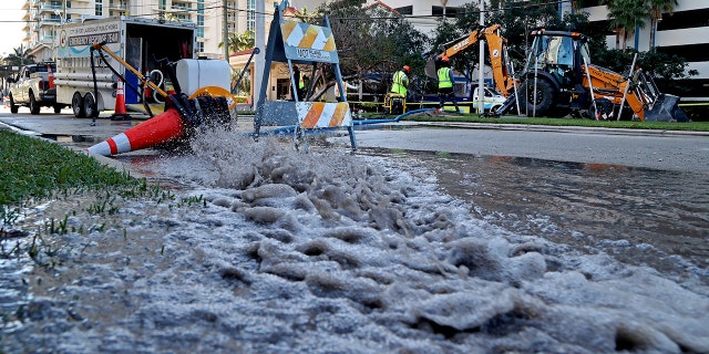 A city of Fort Lauderdale crew responds to a water main break in the area of 100 South Birch Road in Fort Lauderdale Beach. Fort Lauderdale has been dealing with a slew of back-to-back pipe breaks of late. (Susan Stocker/South Florida Sun-Sentinel via AP)