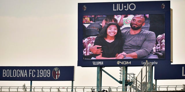 A giant screen shows images commemorating basketball star Kobe Bryant and his daughter Gianna ahead of a Serie A soccer match between Bologna and Brescia, in Bologna, Italy. (Massimo Paolone/LaPresse via AP)