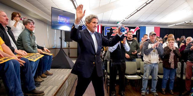 Former Secretary of State John Kerry arrives at a campaign stop for Democratic presidential candidate former Vice President Joe Biden at the South Slope Community Center, Saturday, Feb. 1, 2020, in North Liberty, Iowa. (AP Photo/Andrew Harnik)