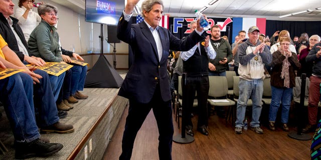 Former Secretary of State John Kerry arrives at a campaign stop for Democratic presidential candidate former Vice President Joe Biden at the South Slope Community Center, Saturday, Feb. 1, 2020, in North Liberty, Iowa. (AP Photo/Andrew Harnik)