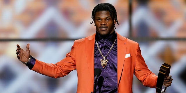 Baltimore Ravens' Lamar Jackson speaks after winning the AP Most Valuable Player award at the NFL Honors football award show Saturday, Feb. 1, 2020, in Miami. (Associated Press)