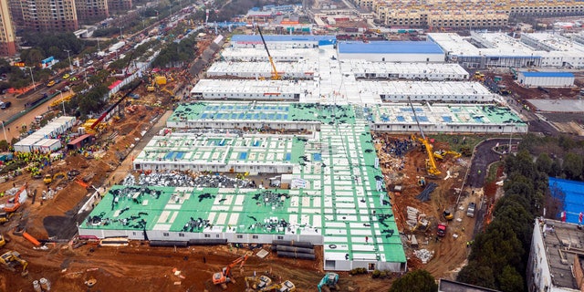 The Huoshenshan temporary field hospital under construction is seen as it nears completion in Wuhan in central China's Hubei Province, Sunday, Feb. 2, 2020. (Chinatopix via AP)