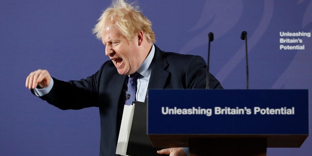 British Prime Minister Boris Johnson outlines his government's negotiating stance with the European Union after Brexit, during a key speech at the Old Naval College in Greenwich, London, Monday, Feb. 3, 2020. (AP Photo/Frank Augstein, Pool)