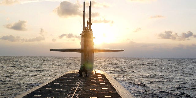 FILE - In this Jan. 9, 2008 photo released by the U.S. Navy, The Ohio-class ballistic-missile submarine USS Wyoming approaches Naval Submarine Base Kings Bay, Ga. The Pentagon's top policy official tells The Associated Press that the United States for the first time has deployed the newest addition to its nuclear arsenal — a submarine-launched weapon that the Trump administration says will make nuclear war less likely. (Lt. Rebecca Rebarich/U.S. Navy via AP)