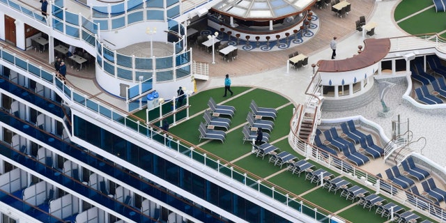 A passenger on the cruise ship has tested positive for a new virus after leaving the ship in Hong Kong on Jan. 25. The ship returned to Yokohama carrying 3,000 passengers and crew members after making port calls in Vietnam, Taiwan and Okinawa. (Kyodo News via AP)