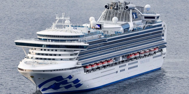 The cruise ship Diamond Princess anchors off the Yokohama Port upon arrival in Yokohama, near Tokyo Tuesday, Feb. 4, 2020. (Kyodo News via AP)