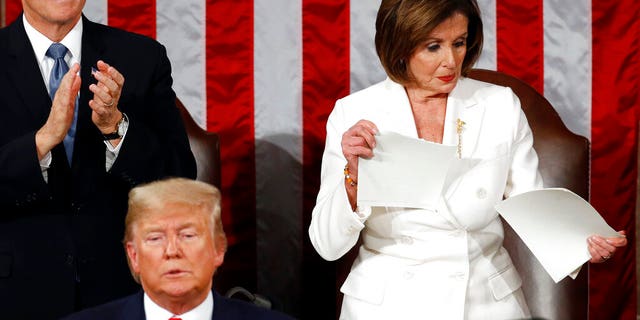 House Speaker Nancy Pelosi of Calif., tears her copy of President Donald Trump's s State of the Union address after he delivered it to a joint session of Congress on Capitol Hill in Washington, Tuesday, Feb. 4, 2020.  (AP Photo/Patrick Semansky)