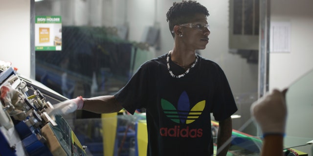 This image released by Netflix shows Zach Ray at work at the Fuyao Glass America factory in Dayton, Ohio, in a scene from the Oscar-nominated documentary "American Factory."