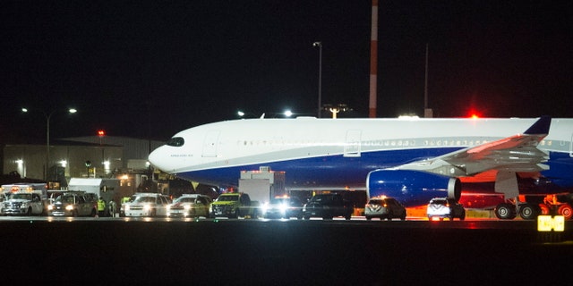 A plane carrying Canadians back from Wuhan, China, is pictured on the tarmac at Vancouver International Airport, in Richmond, British Columbia, Thursday, Feb. 6, 2020. (Jonathan Hayward/The Canadian Press via AP)
