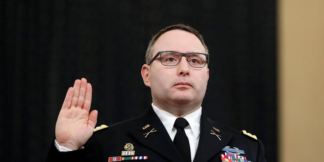 Then-National Security Council aide Lt. Col. Alexander Vindman was sworn in to testify before the House Intelligence Committee on Capitol Hill in Washington during a public impeachment hearing of President Donald Trump's efforts to tie U.S. aid for Ukraine to investigations of his political opponents.