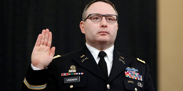 Then-National Security Council aide Lt. Col. Alexander Vindman was sworn in to testify before the House Intelligence Committee on Capitol Hill in Washington during a public impeachment hearing of President Donald Trump's efforts to tie U.S. aid for Ukraine to investigations of his political opponents.