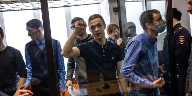 Members of a left-wing group Set (Network) attend a court hearing in Penza, Russia, Monday, Feb. 10, 2020.