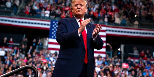 President Donald Trump arrives at SNHU Arena to speak at a campaign rally, Monday, Feb. 10, 2020, in Manchester, N.H. (AP Photo/Evan Vucci)