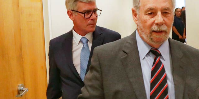 In this April 17, 2019, photo, Timothy Williams, walking behind his attorney Philip Scardino, leaves Harris County Criminal Court at Law No. 9 in Houston. (Jon Shapley/Houston Chronicle via AP)