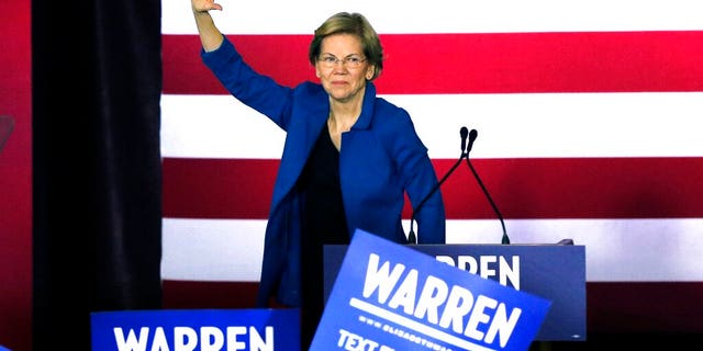 Democratic presidential candidate Sen. Elizabeth Warren, D-Mass., waves to supporters as she leaves the stage after a primary election night rally, Tuesday, Feb. 11, 2020, in Nashua, N.H. (AP Photo/Bill Sikes)