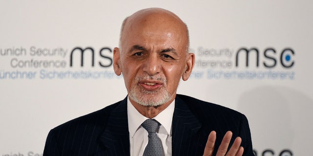 Afghan President Ashraf Ghani speaks on the second day of the Munich Security Conference in Munich, Germany, Saturday, Feb. 15, 2020. (AP Photo/Jens Meyer)