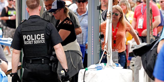 Secret Service Agents searching fans as they entered the Fan Zone before the Daytona 500.
