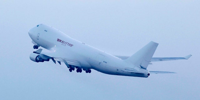 An airplane chartered by the U.S. government taking off at Haneda Airport in Tokyo with U.S. passengers who were aboard the quarantined cruise ship. (Sadayuki Goto/Kyodo News via AP)