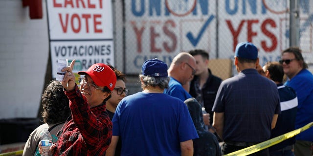 People wait in line to vote early at the Culinary Workers union Monday, Feb. 17, 2020, in Las Vegas. (AP Photo/John Locher)