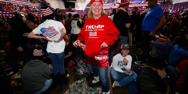 Jody Miller of Scottsdale, Ariz., waiting for an appearance by President Trump at the rally Thursday in Colorado Springs. (AP Photo/David Zalubowski)