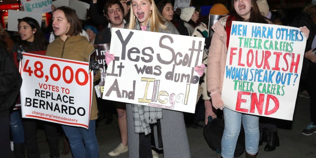 Protesters demonstrate at the Broadway opening night of "West Side Story" at The Broadway Theatre on Thursday, Feb. 20, 2020, in New York.