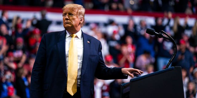 President Trump at the podium for his Thursday night rally. (AP Photo/Evan Vucci)