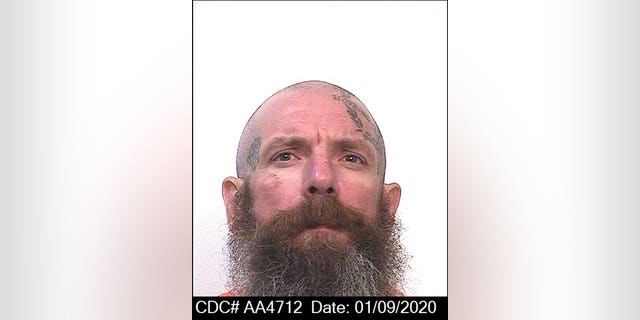 This Jan. 9, 2020 file photo released by the California Department of Corrections and Rehabilitation shows Jonathan Watson. Watson has confessed that he beat two child molesters to death with a cane while behind bars and says his urgent warning to a counselor that he might become violent was ignored.