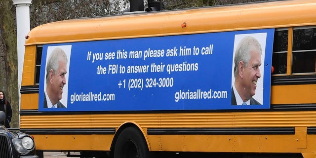 A yellow school bus with a message for the Britain's Prince Andrew, from US lawyer Gloria Allred, drives along The Mall towards Buckingham Palace in London Friday Feb. 21, 2020. (Associated Press)