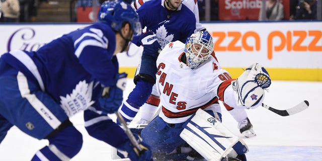 Toronto Maple Leafs left wing Pierre Engvall (47) scores his team's third goal of the game against Carolina Hurricanes emergency goalie David Ayres (90) during second-period NHL hockey game action in Toronto, Saturday, Feb. 22, 2020. (Associated Press)