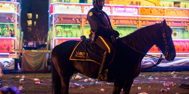 A police officer works the scene where a man was reportedly hit and killed by a float of the Krewe of Endymion parade in the runup to Mardi Gras in New Orleans, Saturday, Feb. 22, 2020. (Associated Press)