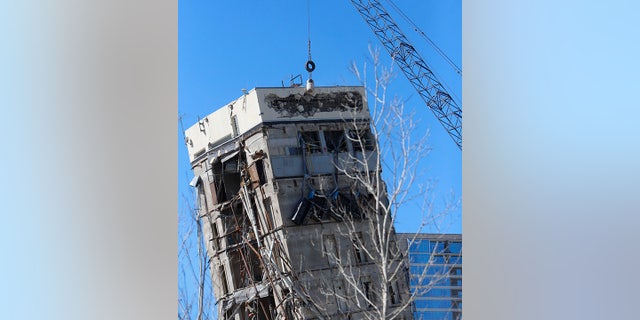 A wrecking ball smashes against the "Leaning Tower of Dallas" north of downtown Dallas, Monday, Feb. 24, 2020.
