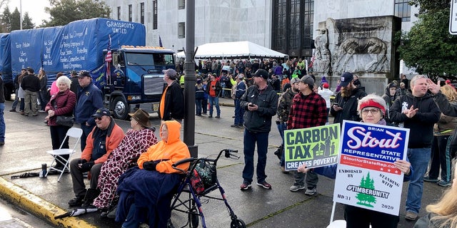 Demonstrators protest a cap-and-trade bill aimed at stemming global warming at the Oregon State Capitol in Salem on Feb. 6, 2020.